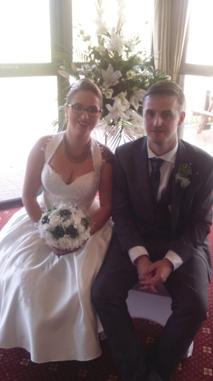 Jemma real bride wearing halter neck short wedding dress
