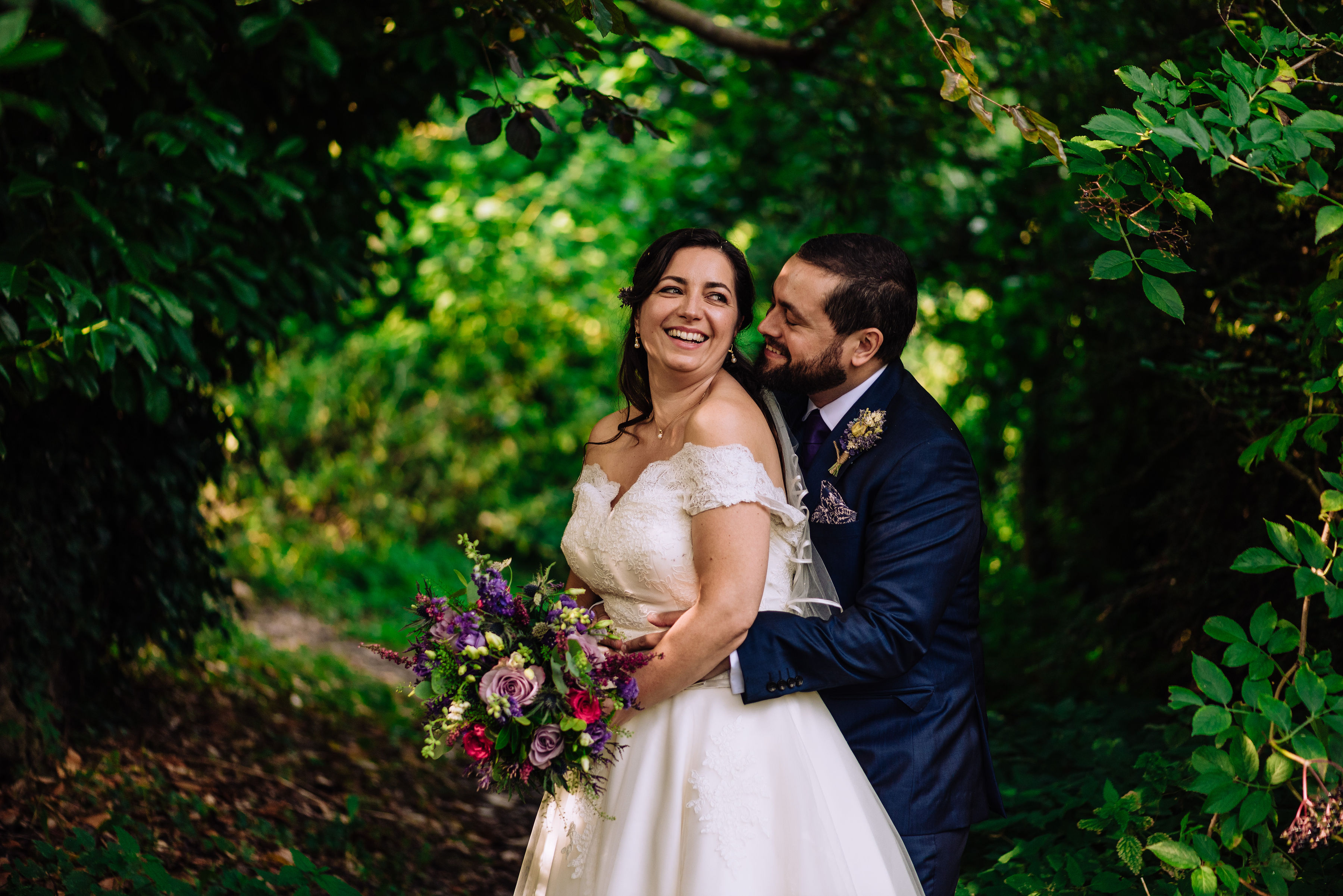 Real bride wearing calf length wedding dress from cutting edge brides