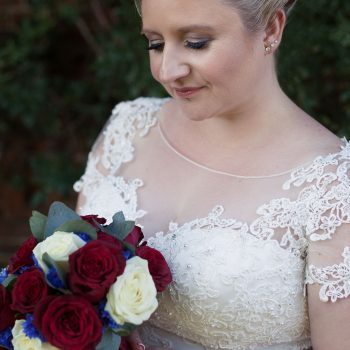 Steph and Harrys wedding with cutting edge brides. Bride with claret flowers
