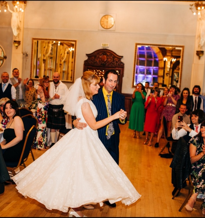 Real wedding featuring a tea length wedding dress
