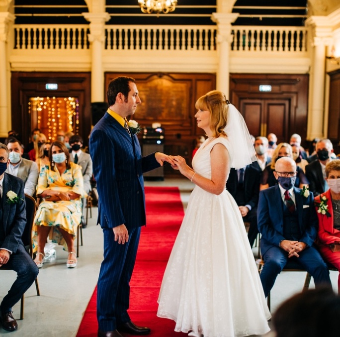 Retro wedding and bride wore ballerina length wedding dress from Cutting Edge Brides